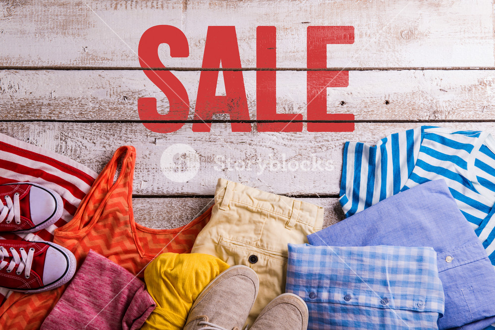 Sale composition. Studio shot on wooden background.